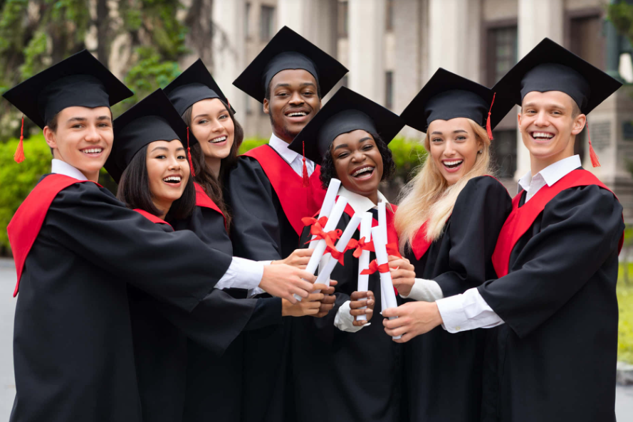 Graduates celebrating together with diplomas